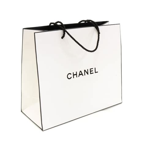 white chanel bag|White Chanel shopping bag.